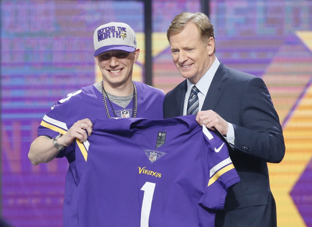 Mike Hughes (Central Florida) with NFL commissioner Roger Goodell after being selected as the number thirty overall pick to the Minnesota Vikings in the first round of the 2018 NFL Draft at AT&T Stadium. Tim Heitman