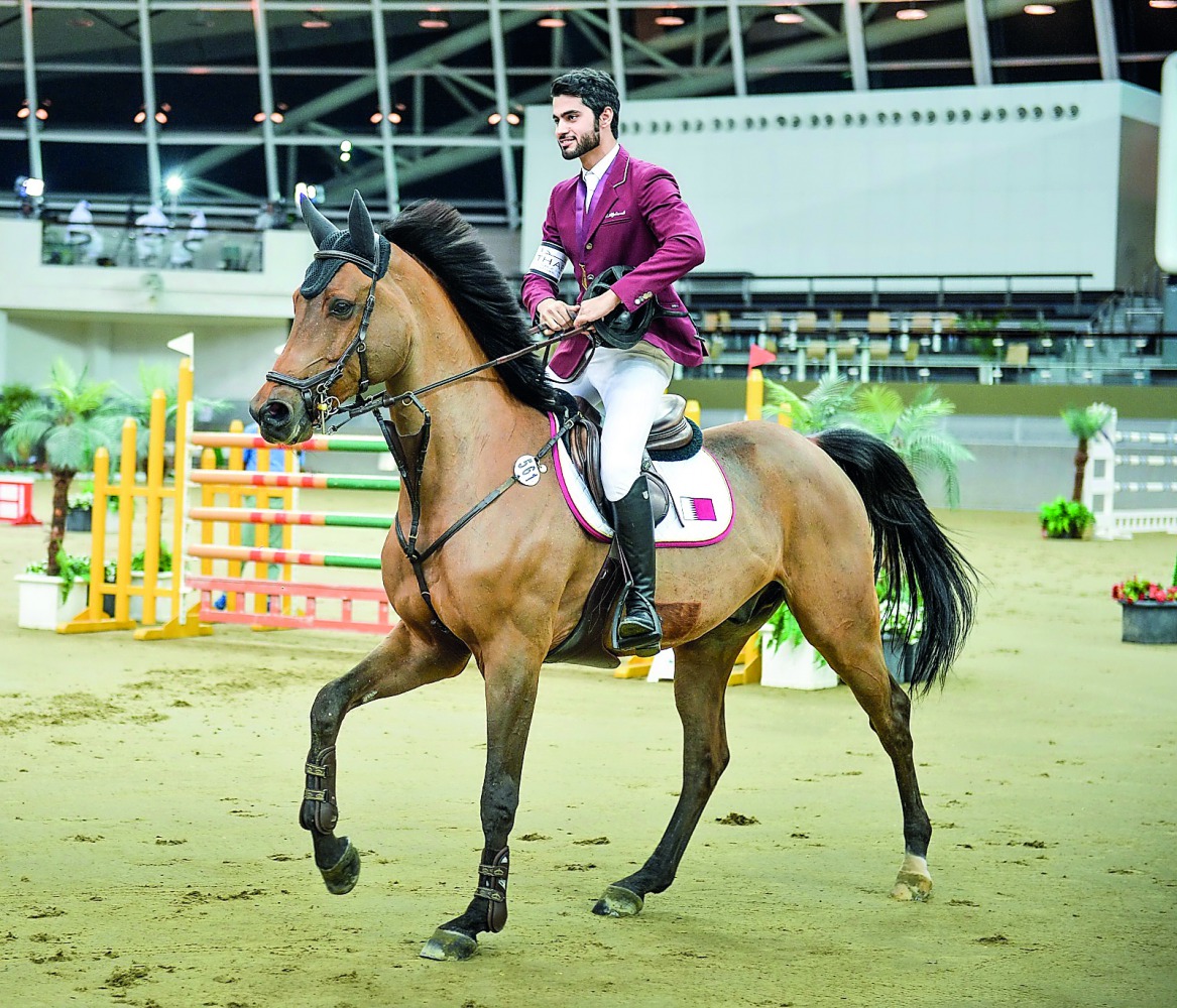 Nasser Al Ghazali, winner of the Big Tour of the final leg of the Hathab Equestrian Tour, arriving at the podium astride Quel Homme.
