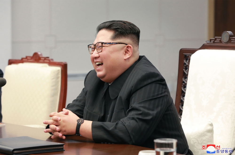 This picture taken on April 27, 2018 and released from North Korea's official Korean Central News Agency (KCNA) on April 29, 2018 shows North Korea's leader Kim Jong Un speaking with South Korea's President Moon Jae-in (unseen) during the Inter-Korean sum