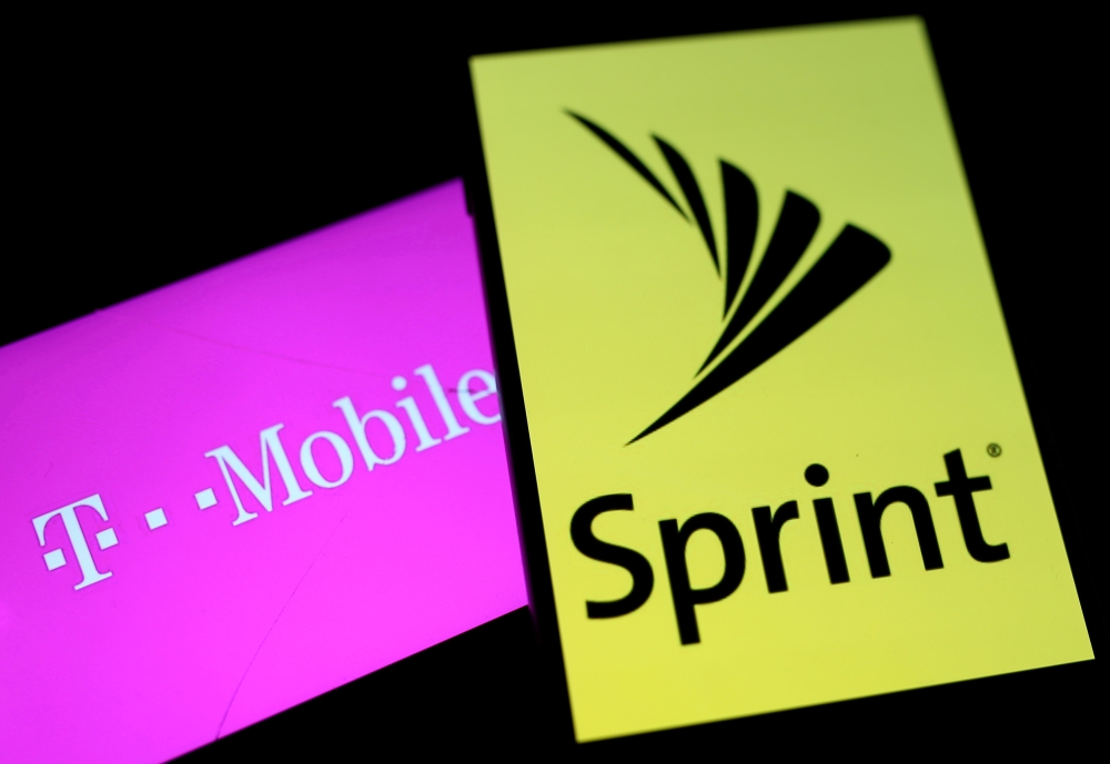 Smartphones with the logos of T-Mobile and Sprint are seen in this illustration taken September 19, 2017. Reuters/Dado Ruvic