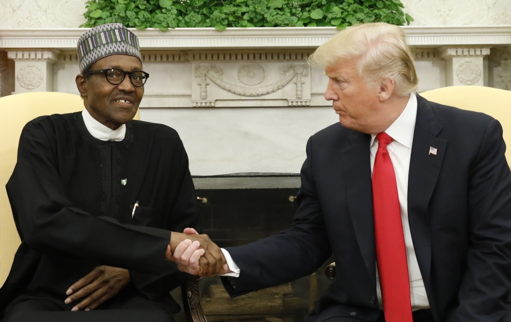 U.S. President Donald Trump meets with Nigeria's President Muhammadu Buhari in the Oval Office of the White House in Washington, U.S., April 30, 2018. REUTERS/Kevin Lamarque
