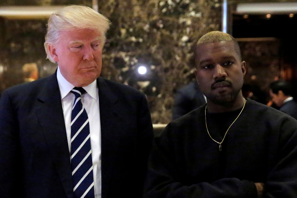 FILE PHOTO: US President-elect Donald Trump and musician Kanye West pose for media at Trump Tower in Manhattan, New York, U.S., December 13, 2016. REUTERS/Andrew Kelly/File Photo