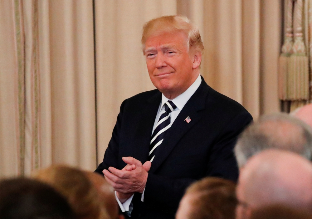 U.S. President Donald Trump arrives for a swearing-in ceremony for U.S. Secretary of State Mike Pompeo at the State Department in Washington, U.S., May 2, 2018. REUTERS/Jonathan Ernst