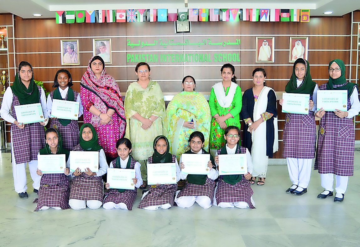 Students showing their certificates.