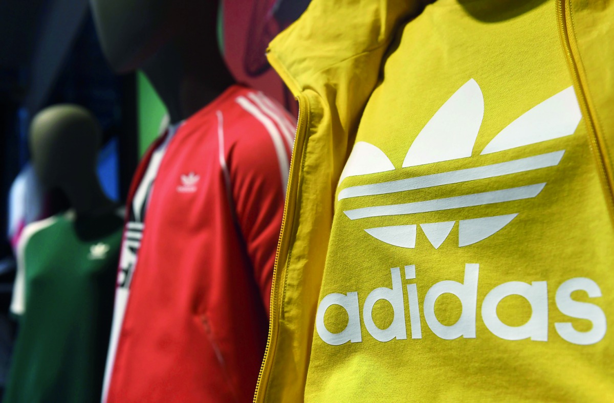 The logo of Adidas is seen on a shirt in Herzogenaurach, southern Germany. German sportswear maker Adidas reported yesterday that efficiency savings had powered a leap in profits in the first quarter, staying confident of hitting its full-year targets as 