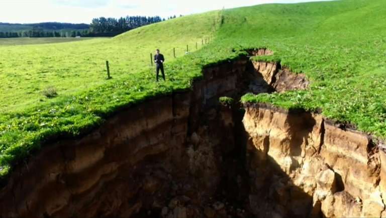 This frame grab from TVNZ video footage taken on May 2, 2018 and released to AFP on May 7 shows a sinkhole that appeared on a dairy farm near Rotorua on New Zealand's North Island. AFP Photo / TVNZ