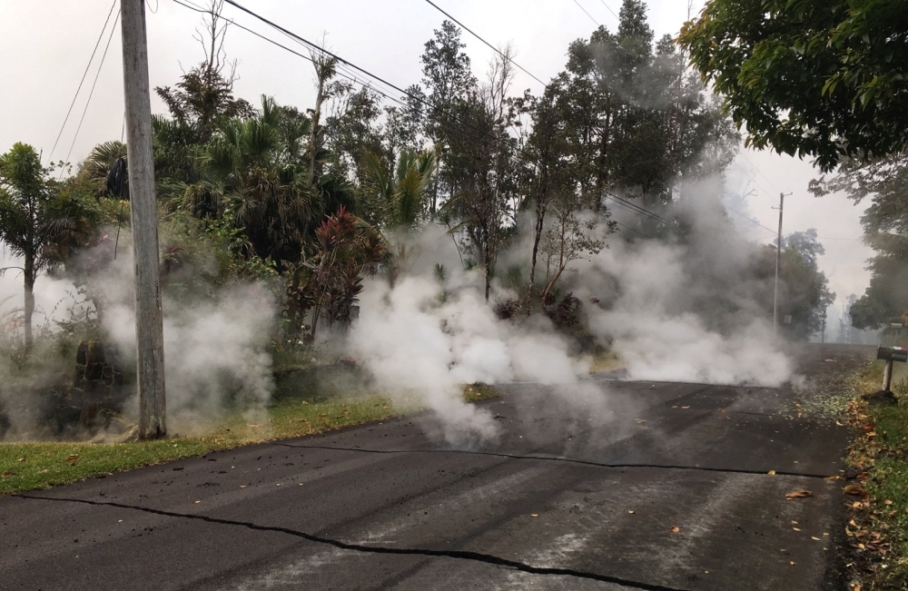 Steam rises from fissure 9 on Moku Street in the Leilani Estates subdivision, in Hawaii, U.S. May 7, 2018. Picture taken on May 7, 2018. USGS