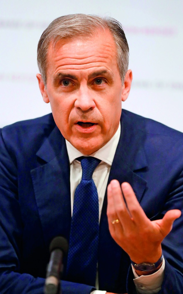 Bank of England Governor, Mark Carney, attends the central bank's quarterly Inflation Report press conference in London, on May 10, 2018.  AFP / Frank Augstein

