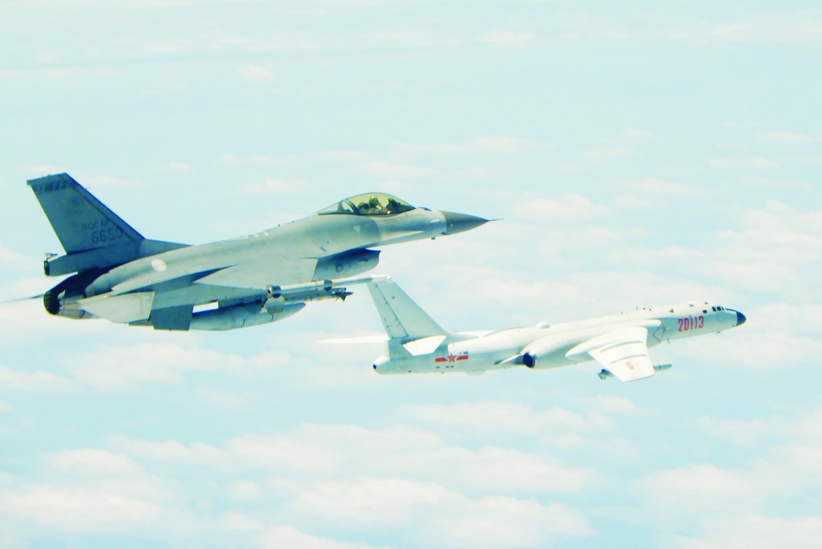 Republic of China (Taiwan) Air Force F-16 fighter aircraft (L) flying alongside a Chinese People's Liberation Army Air Force (PLAAF) H-6K bomber that reportedly flew over the Bashi Channel, south of Taiwan, and over the Miyako Strait, near Japan's Okinawa