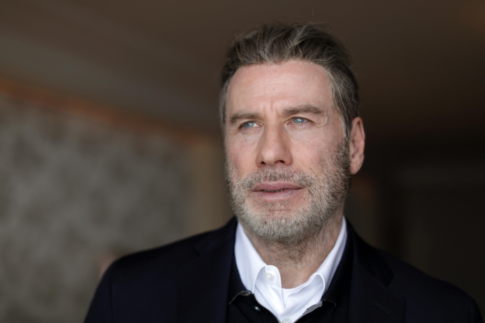 John Travolta poses during a rendez-vous for the film Gotti, 71st Cannes Film Festival - Cannes, France, May 14, 2018. Reuters/Eric Gaillard