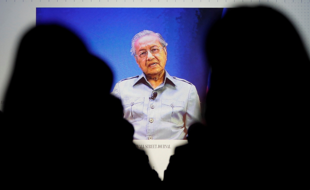 Malaysia's Prime Minister Mahathir Mohamad is seen on video conference screen during the Wall Street Journal CEO Conference in Tokyo, Japan May 15, 2018. REUTERS/Tor