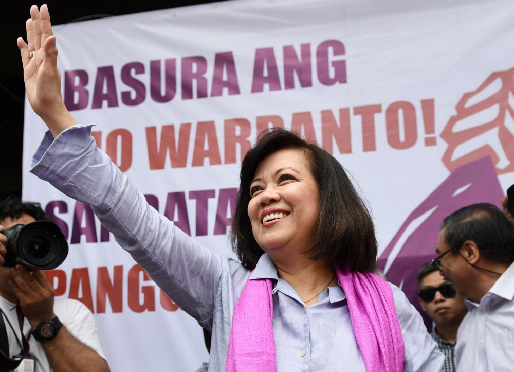 Ousted Philippine Supreme Court Justice Maria Lourdes Sereno waves to supporters at a rally outside the Supreme Court building on Taft Avenue, metro Manila, Philippines May 11, 2018. REUTERS/Dondi Tawatao