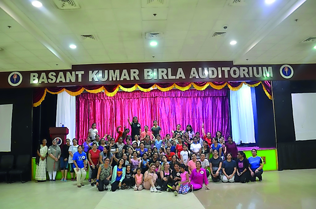 Participants pose with the trainer at the Zumba session organised by Indian Sports Center’s Yoga and Fitness Committee at Birla Public School auditorium. 
