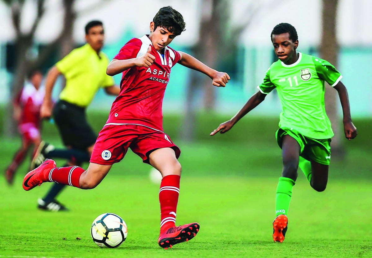 Young players in action during the Aspire Academy Tri-Series football tournament. 