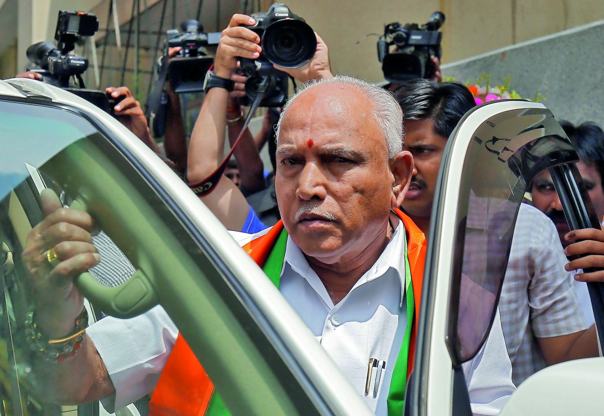 India's ruling Bharatiya Janata Party (BJP) leader and former Chief Minister of the southern state of Karnataka B. S. Yeddyurappa leaves to meet the state governor to stake claim to form the government, in Bengaluru, India, May 16, 2018. Reuters/Abhishek 