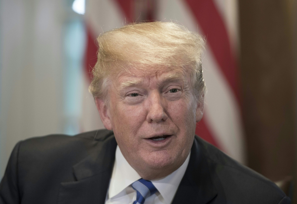 US President Donald Trump makes remarks at a roundtable meeting on sanctuary cities May 16, 2018, in the Cabinet Room at the White House in Washington, DC. / AFP / Jim WATSON