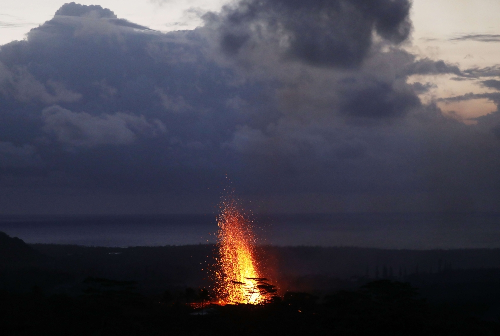 Lava erupts from a Kilauea volcano fissure on Hawaii's Big Island on May 18, 2018 in Kapoho, Hawaii. Mario Tama/Getty Images/AFP 
