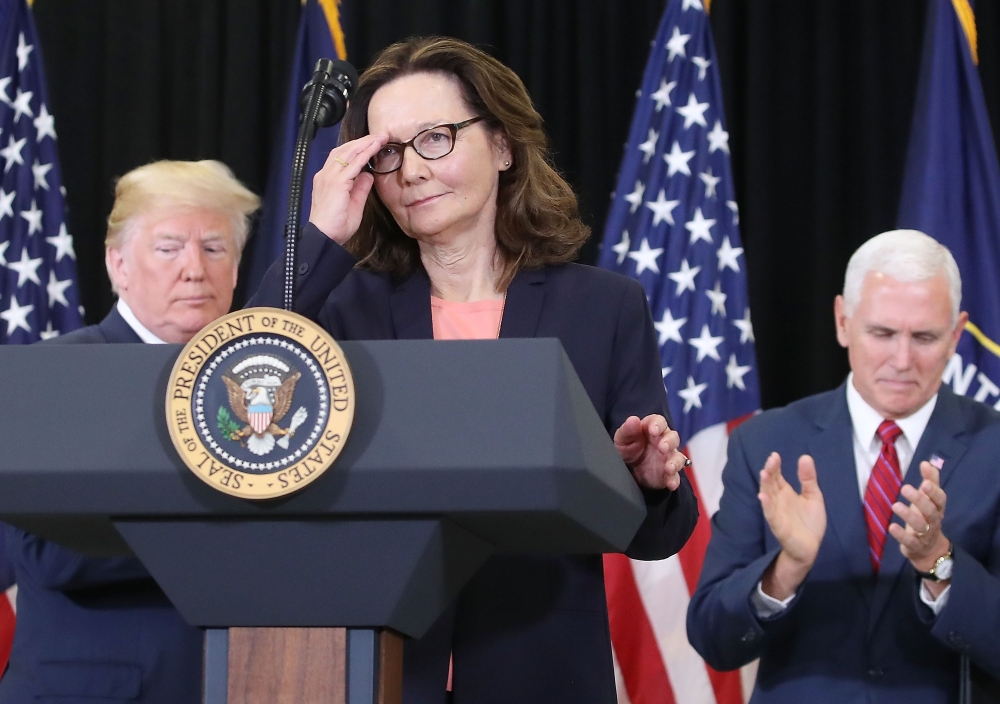Gina Haspel prepares to speak while flanked by U.S. President Donald Trump (L) and Vice President Mike Pence, after she was sworn in as CIA director during a swearing-in ceremony at agency headquarters, May 21, 2018 in Langley, Virginia. Mark Wilson/AFP 