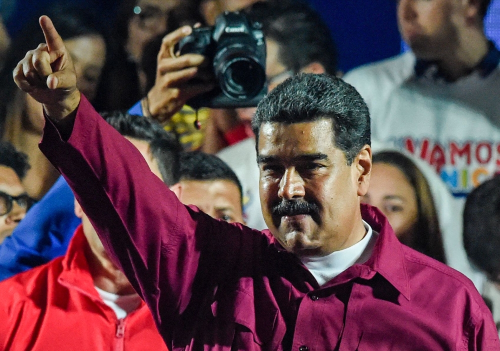 Venezuelan President Nicolas Maduro gestures after the National Electoral Council (CNE) announced the results of the voting on election day in Venezuela, on May 20, 2018.  AFP / Juan Barreto