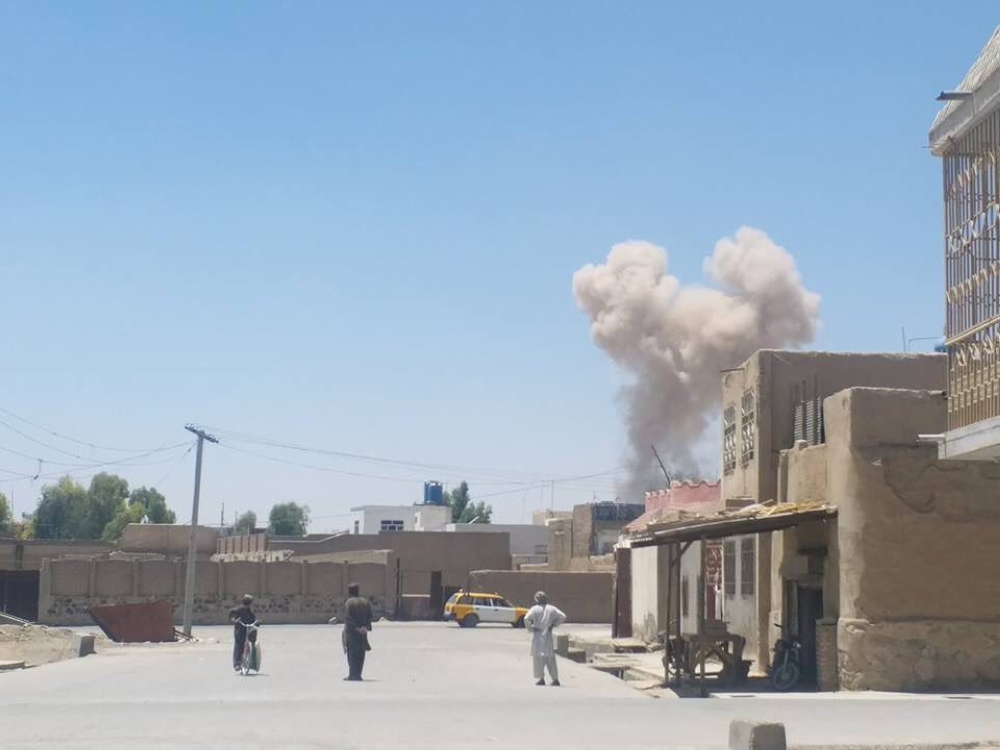 A cloud of smoke is seen after an explosion in Kandahar, Afghanistan May 22, 2018 in this picture obtained from social media. AZEEM ZMARIAL
