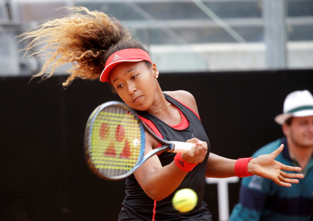 FILE PHOTO: Tennis - WTA Premier 5 - Italian Open - Foro Italico, Rome, Italy - May 14, 2018 Japan's Naomi Osaka in action during her first round match against Belarus' Victoria Azarenka REUTERS/Max Rossi/File Photo