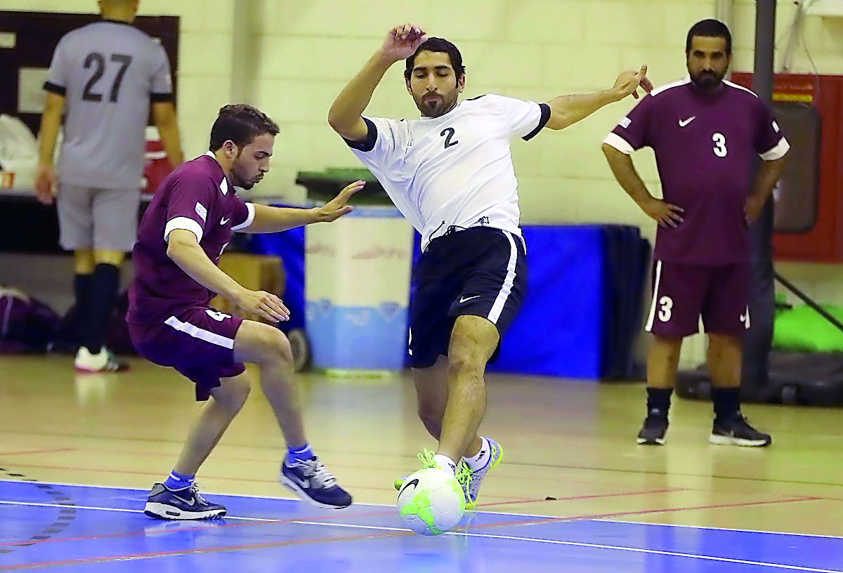 Action during the Qatar Olympic Committee (QOC) Ramadan Futsal Tournament on Tuesday.