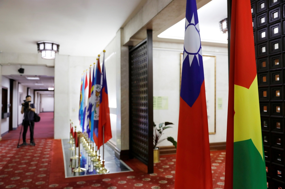 Flags of Taiwan (2nd-R) and Burkina Faso (R) are seen inside Taiwan's Ministry of Foreign Affairs in Taipei, Taiwan on May 24, 2018. REUTERS/Tyrone Siu
