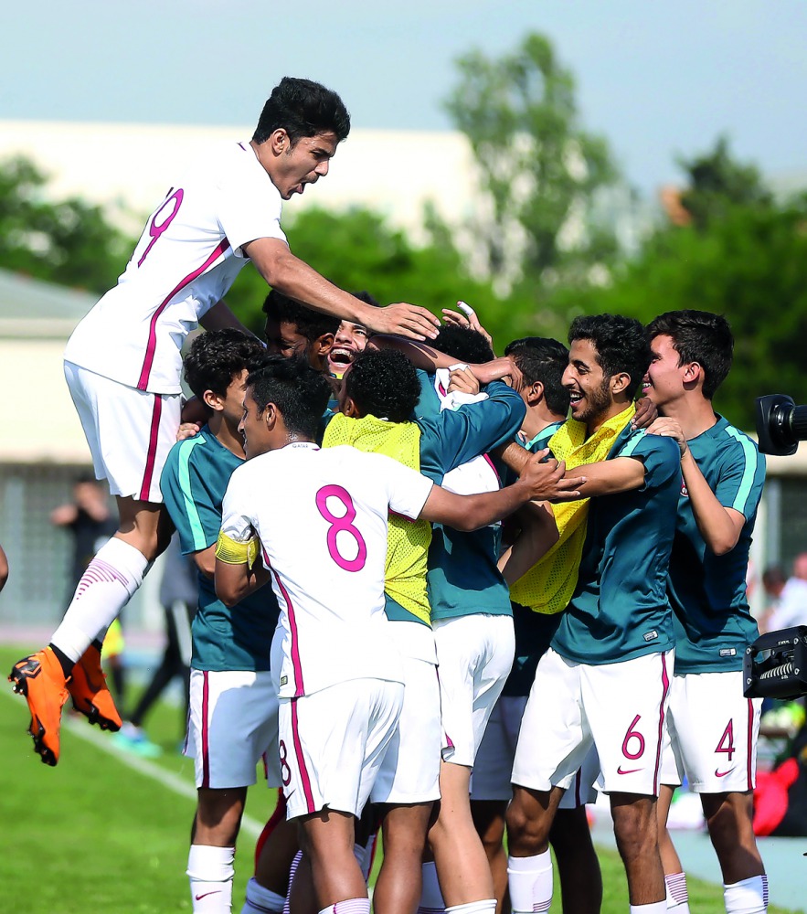 Qatar U-21 players celebrate after Ahmed Jenahi scored against China U-21 in their Toulon International Championship match played in France yesterday.