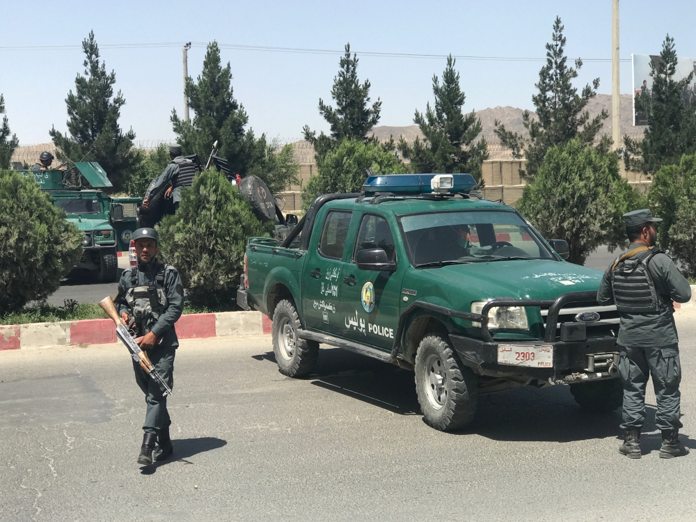 Afghan policemen stand guard amid an attack and gunfire in Kabul, Afghanistan. Reuters/Mohammad Ismail