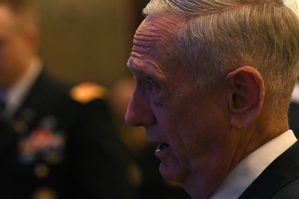 US Defence Secretary James Mattis arrives to deliver his speech during the first plenary session of the 17th Asian Security Summit of the IISS Shangri-La Dialogue in Singapore on June 2, 2018.   AFP / ROSLAN RAHMAN