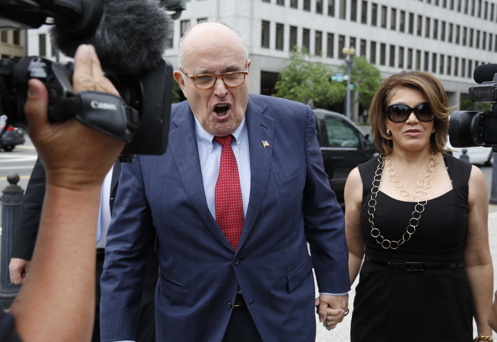 President Donald Trump's attorney Rudy Giuliani arrives with his guest Jennifer Leblanc at the White House in Washington, U.S., May 30, 2018. REUTERS/Joshua Roberts