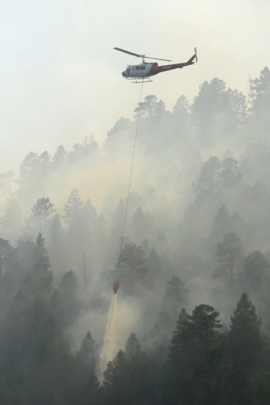 A helicopter drops water on the 416 Fire near Durango, Colorado, U.S. in this June 4, 2018 handout photo obtained by Reuters June 5, 2018. La Plata County/Handout via REUTERS 