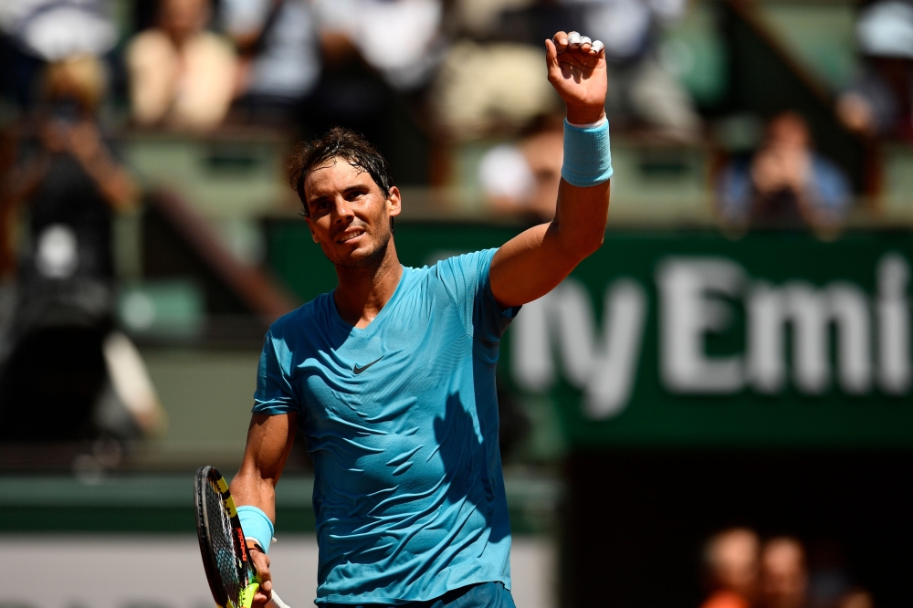 Spain's Rafael Nadal celebrates after victory over Argentina's Diego Schwartzman at the end of their men's singles quarter-final match on day twelve of The Roland Garros 2018 French Open tennis tournament in Paris on June 7, 2018. (AFP / CHRISTOPHE SIMON)
