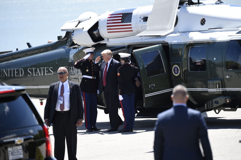US President Donald Trump disembarks from Marine One upon arrival at Fairmont Le Manoir Richelieu Landing Zone in Charlevoix, Quebec, Canada, June 8, 2018, as Trump travels to attend the G7 Summit. (AFP / SAUL LOEB)