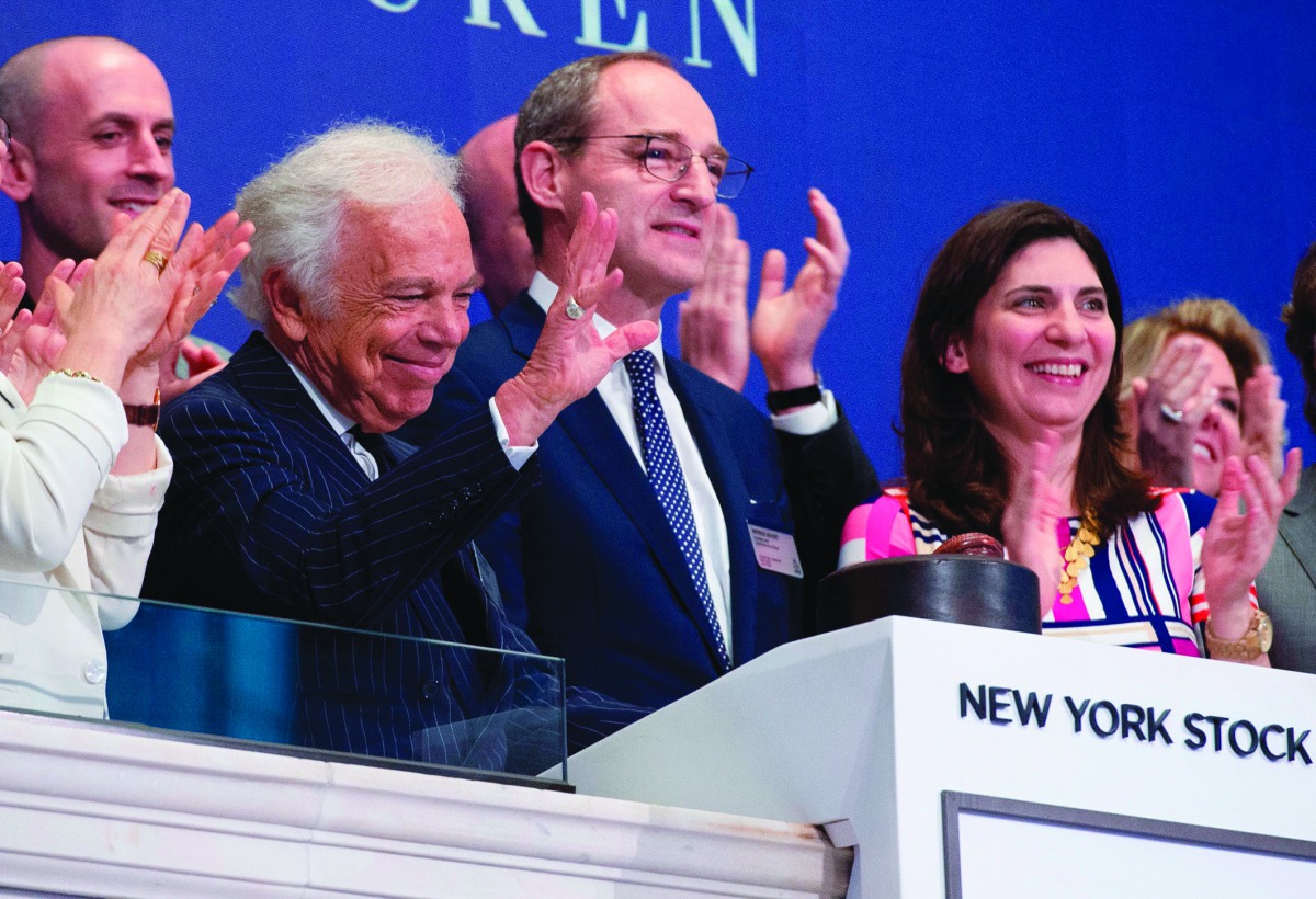 Executive Chairman and Chief Creative Officer Ralph Lauren with the NYSE President Stacey Cunningham (R) rings the closing bell to celebrate 50 years at the Dow Industrial Average at the New York Stock Exchange on June 7, 2018 in New York.  AFP / Bryan R 