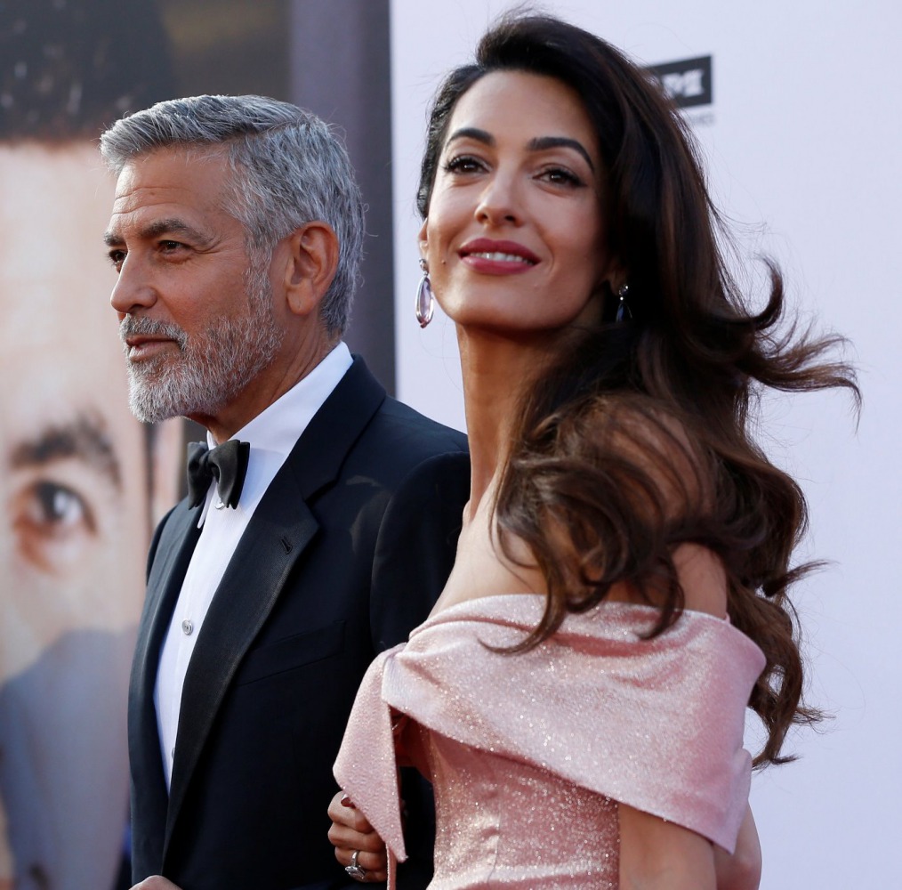 Actor George Clooney and his wife Amal pose at the 46th AFI Life Achievement Award Gala in Los Angeles, California, U.S., June 7, 2018. REUTERS/Mario Anzuoni