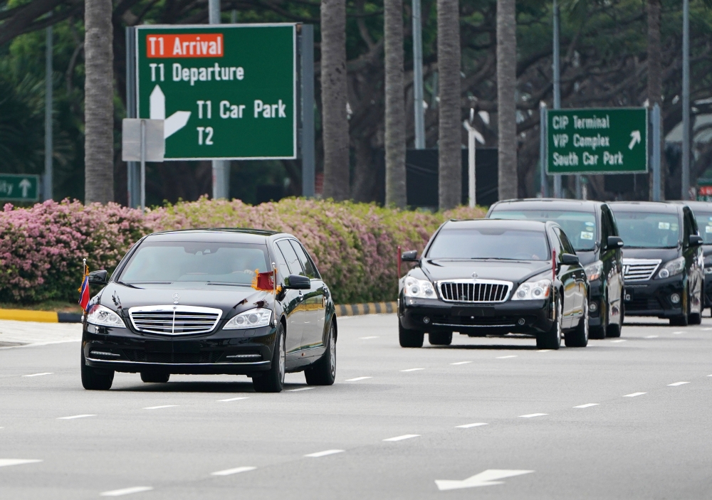 A motorcade believed to be carrying North Korea's leader Kim Jong Un travels past in Singapore June 10, 2018. REUTERS/Athit Perawongmetha