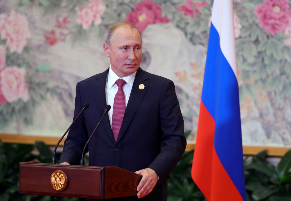 Russian President Vladimir Putin attends a news conference on the results of the Shanghai Cooperation Organisation (SCO) summit in Qingdao, China June 10, 2018. Sputnik/Mikhael Klimentyev/Kremlin via REUTERS 