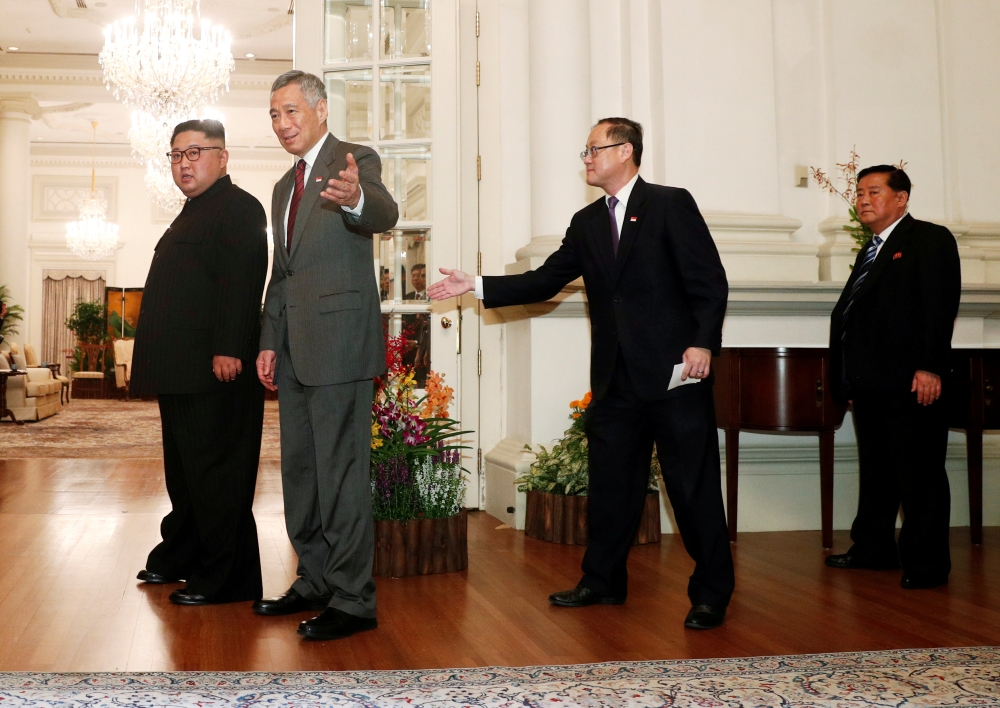 Singapore Prime Minister Lee Hsien Loong gestures towards the media as he meets with North Korea's leader Kim Jong Un at the Istana in Singapore June 10, 2018. Reuters/Edgar Su

