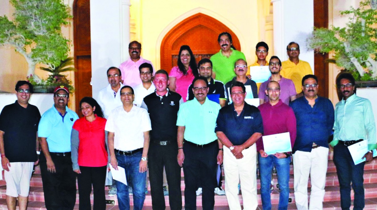 Golf enthusiasts who underwent a two-month coaching camp pose for a group picture.