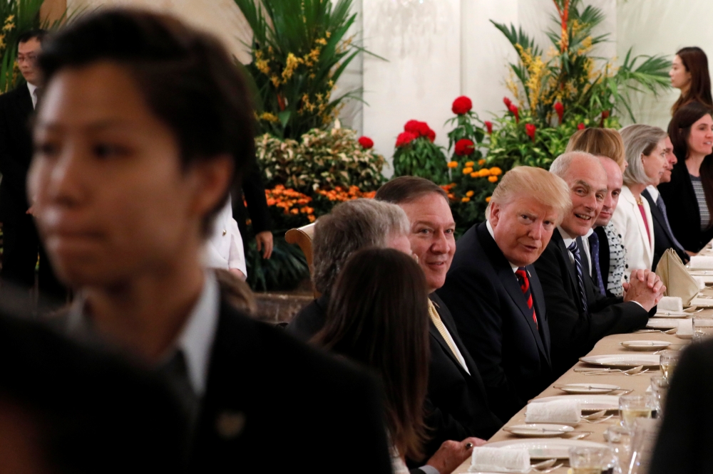 US President Donald Trump attends lunch during a meeting at the Istana in Singapore June 11, 2018. REUTERS/Jonathan Ernst
