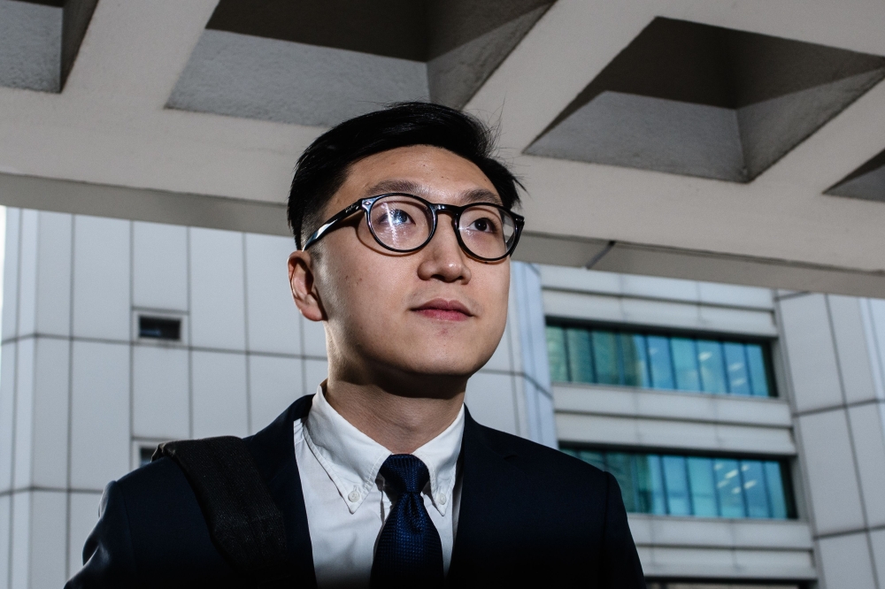 (FILES) In this file photo taken on January 18, 2018, pro-independence protestor Edward Leung arrives at the High Court before facing rioting charges in Hong Kong, for his part in the 'fishball riots' that took place in February 2016. AFP / Anthony Wallac