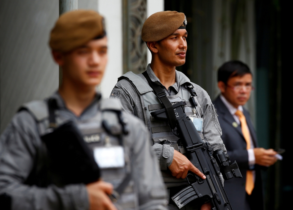 FILE PHOTO: Gurkha policemen stand guard at the venue of the 16th IISS Shangri-La Dialogue in Singapore June 2, 2017. REUTERS/Edgar Su/File Photo