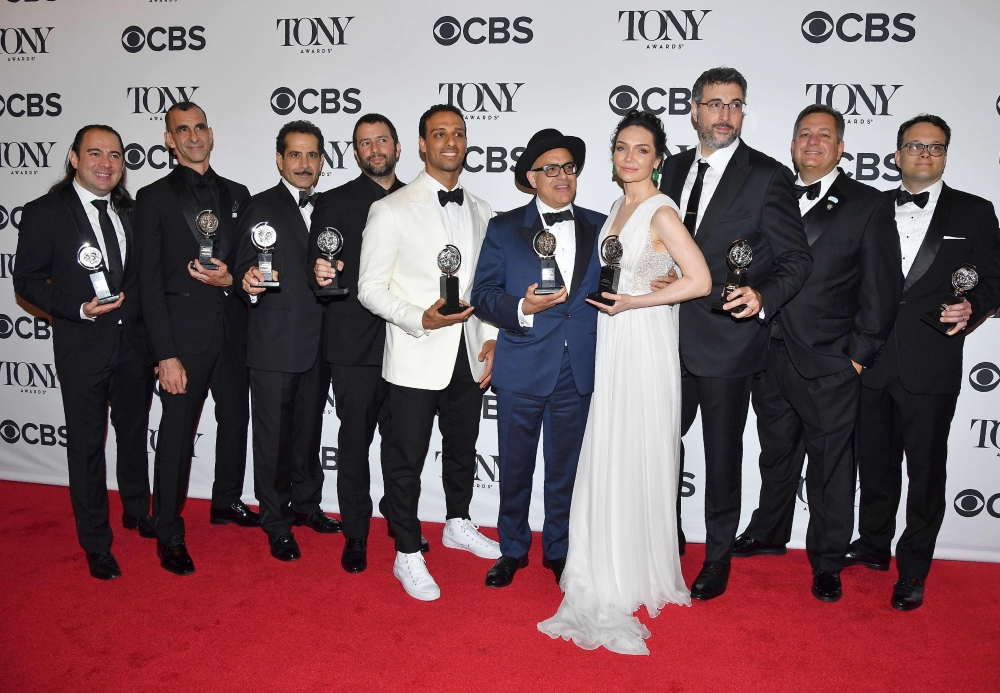 Cast and creative team of 'The Band's Visit' pose in the 72nd Annual Tony Awards Media Room at 3 West Club in New York City on June 10, 2018. / AFP / ANGELA WEISS
