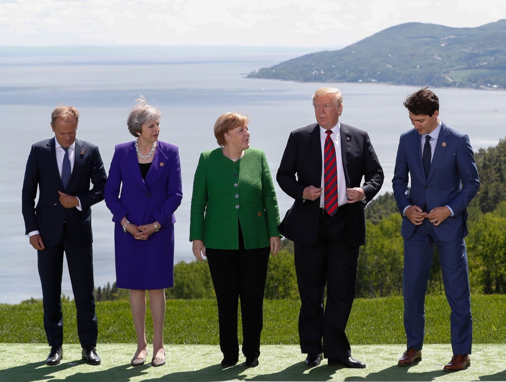 European Council President Donald Tusk, Britain's Prime Minister Theresa May, Germany's Chancellor Angela Merkel, U.S. President Donald Trump and Canada's Prime Minister Justin Trudeau pose during a family photo at the G7 Summit in the Charlevoix city of 