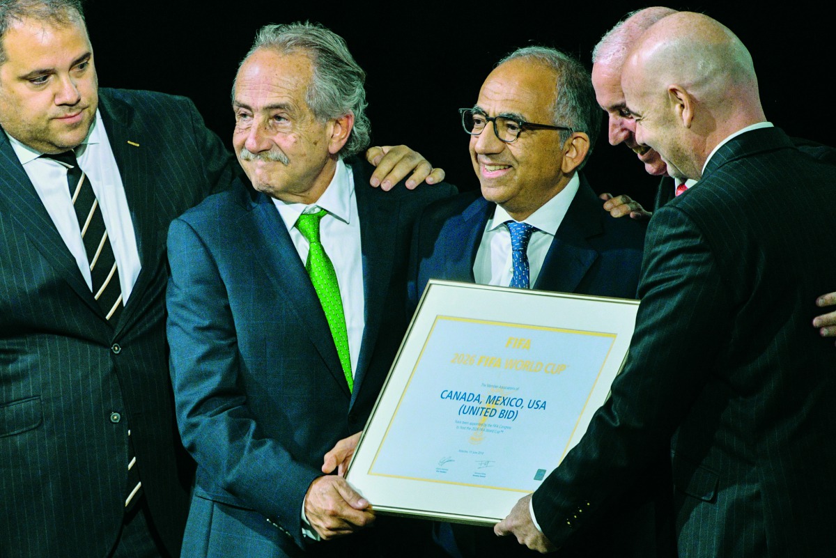 FIFA president Gianni Infantino (R) poses with the United 2026 bid (Canada-Mexico-US) officials Carlos Cordeiro (3rd R), president of the United States Football Association, president of the Mexican Football Association Decio de Maria Serrano (2nd L), Ste