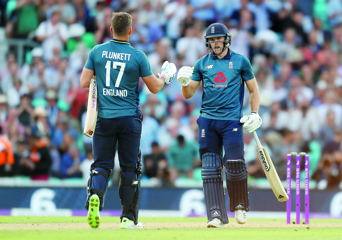 England's David Willey celebrates with Liam Plunkett after winning the match. Action Images via Reuters/Paul Childs
