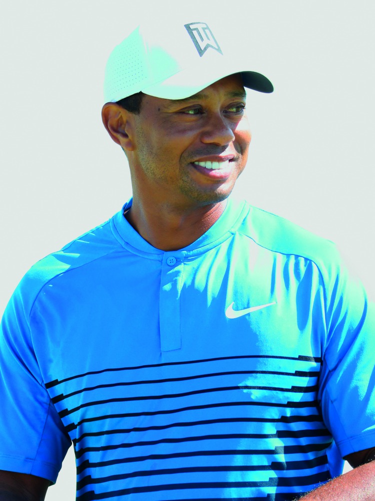  Tiger Woods of the United States smiles on the eighth green during a practice round prior to the 2018 U.S. Open at Shinnecock Hills Golf Club on June 12, 2018 in Southampton, New York. Warren Little/Getty Images/AFP