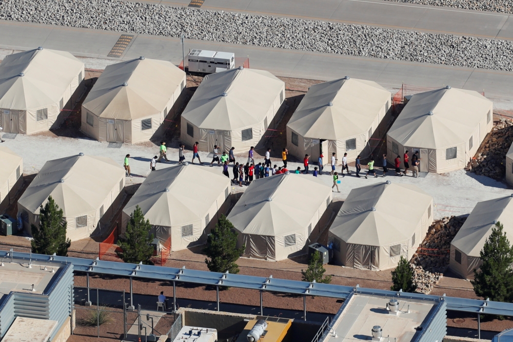 Immigrant children, many of whom have been separated from their parents under a new 