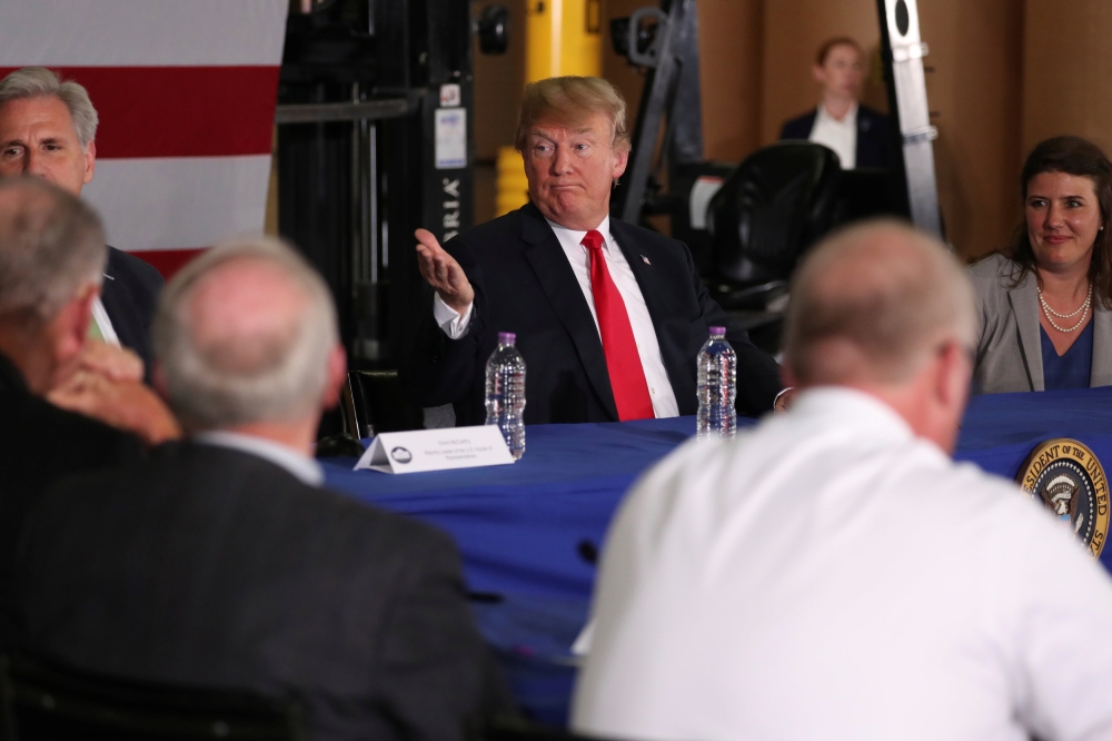 US President Donald Trump participates in a roundtable discussion about trade in Duluth, Minnesota, U.S. June 20, 2018. REUTERS/Jonathan Ernst